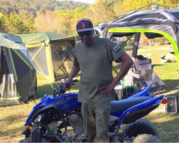 2 Alpha Life participant beside an ATV at camp